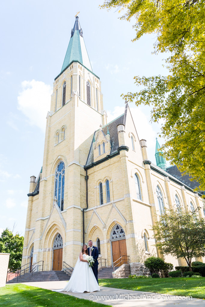 picture of bride and groom in front of St. Joseph Church in Mishawka Indiana