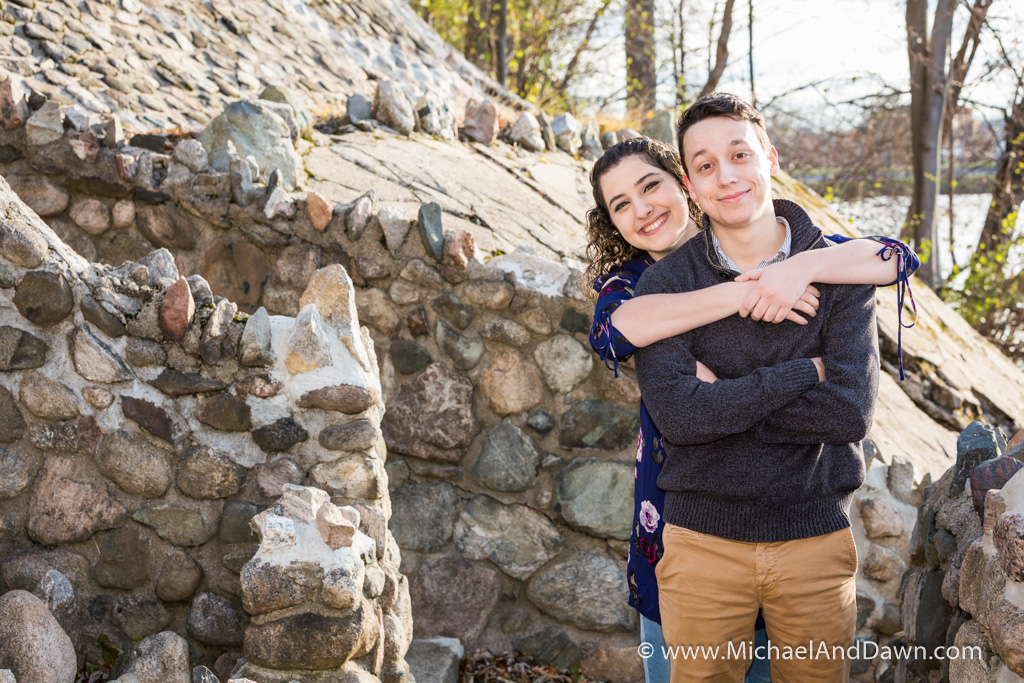 engagement picture of girl's arms around the boy's shoulders